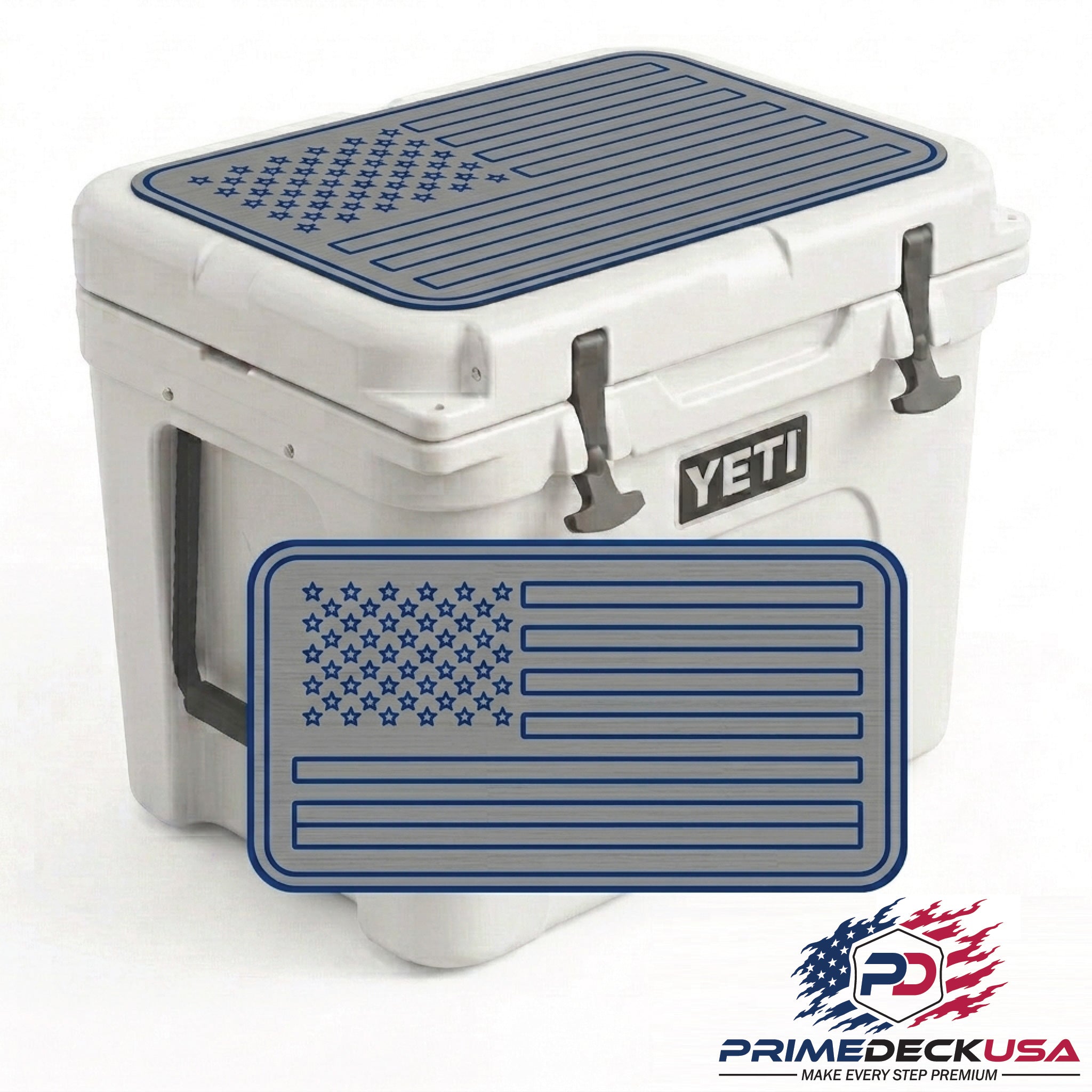A white YETI cooler with a dark blue American flag patterned rubber mat on top and a matching front bumper mat, shown on a white background with a Prime Deck USA logo in the corner.